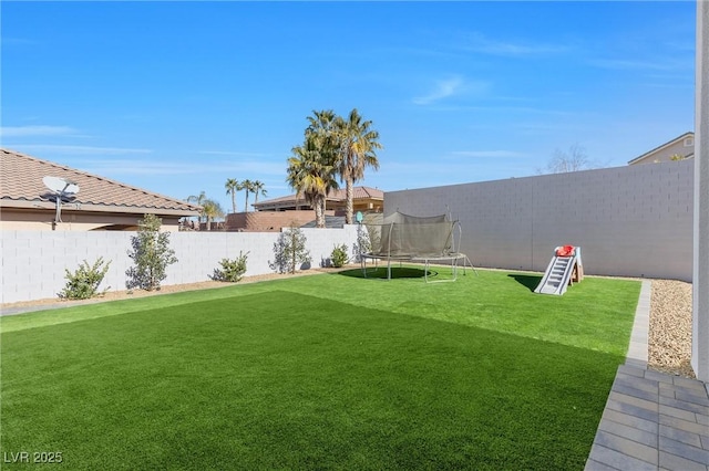 view of yard featuring a trampoline