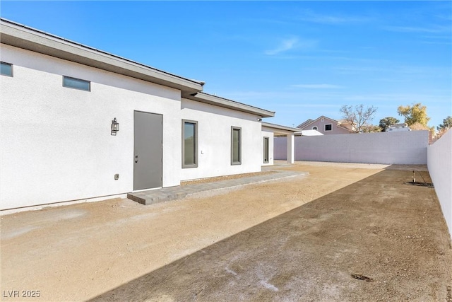 back of property featuring a patio