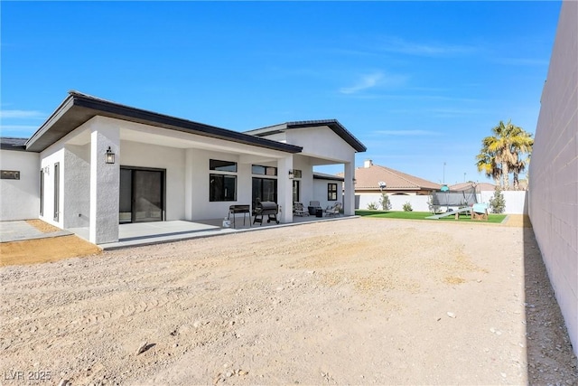 rear view of house featuring a patio