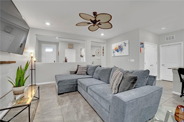 living room with ceiling fan and light tile patterned floors