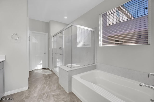 bathroom with vanity, separate shower and tub, and tile patterned flooring