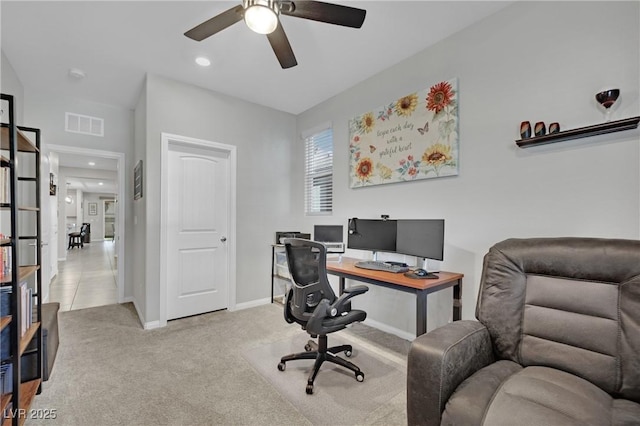 home office with ceiling fan and light colored carpet