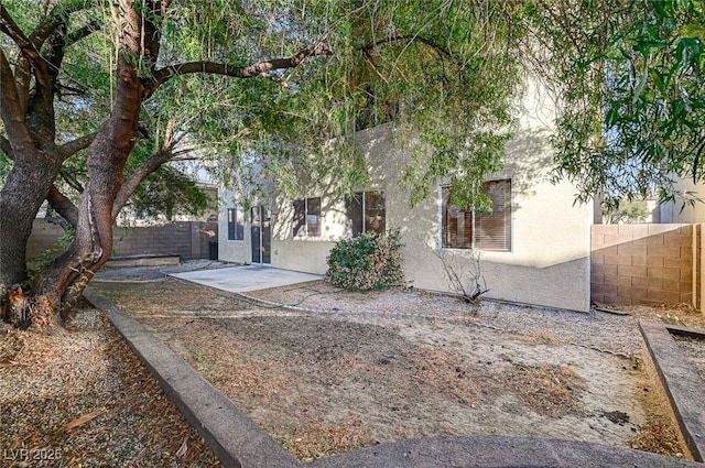 view of front of home featuring a patio