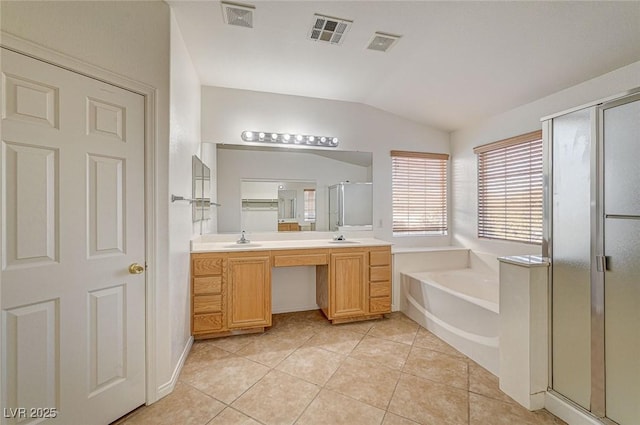 bathroom featuring tile patterned floors, vanity, lofted ceiling, and independent shower and bath