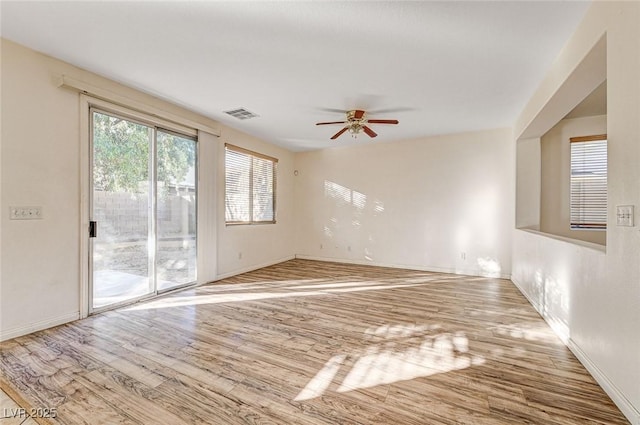 spare room with ceiling fan and light hardwood / wood-style floors