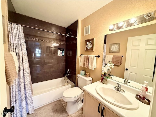 full bathroom with tile patterned floors, toilet, vanity, and shower / bath combination with curtain