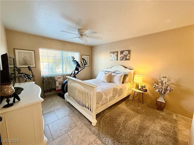 tiled bedroom with ceiling fan