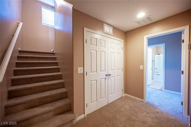 stairway with carpet floors