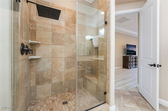 bathroom with tile patterned flooring and walk in shower