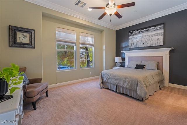 carpeted bedroom with ceiling fan and ornamental molding