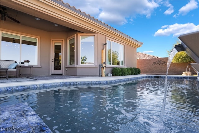 view of pool with pool water feature