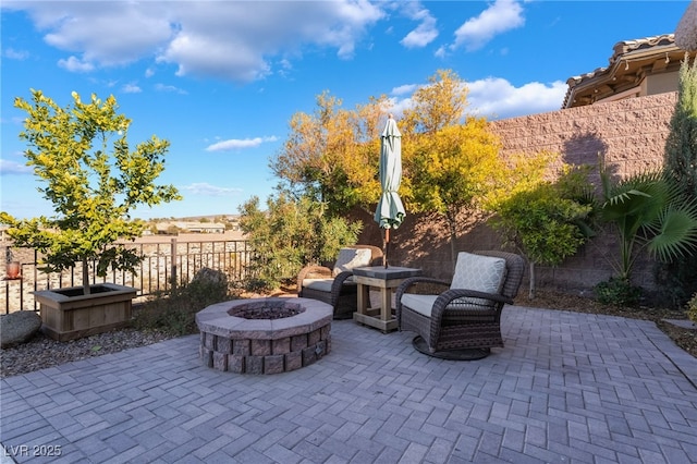 view of patio / terrace featuring a fire pit