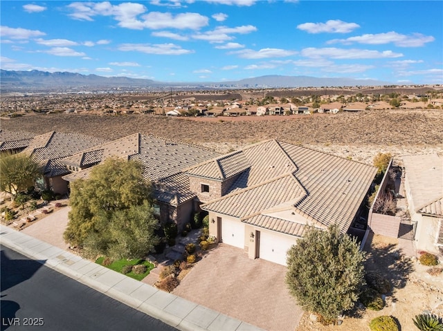 birds eye view of property with a mountain view