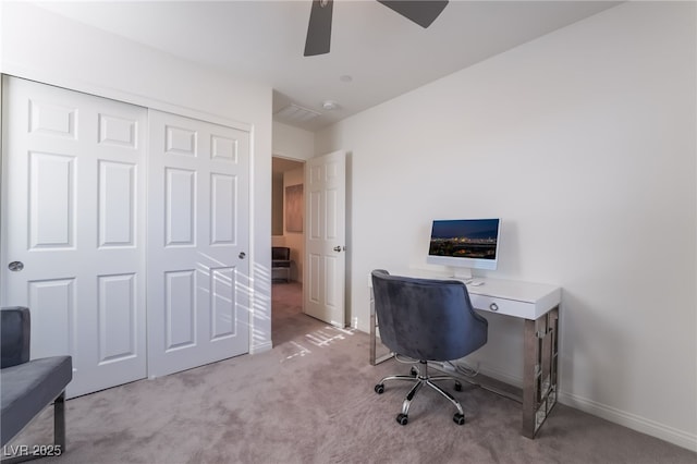 office featuring light carpet and ceiling fan