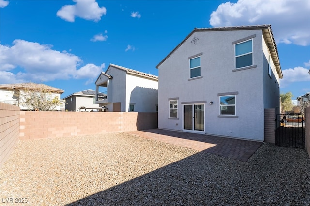 rear view of house with a patio area