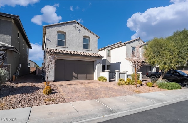 mediterranean / spanish-style home with a garage