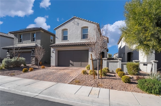 mediterranean / spanish-style home with a garage