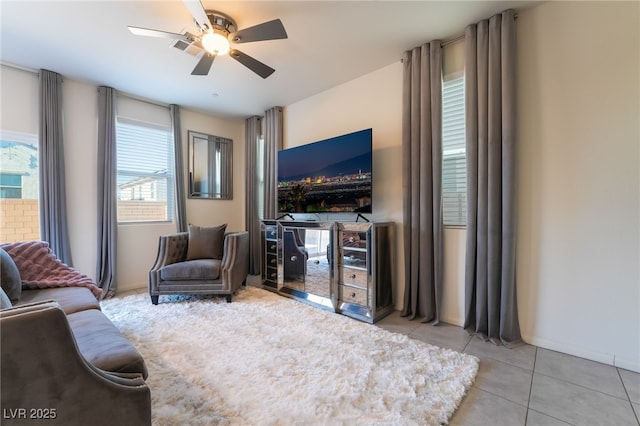 tiled living room with ceiling fan