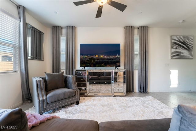 living room with ceiling fan and light tile patterned floors