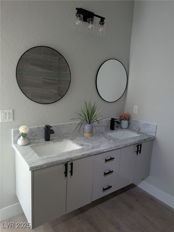 bathroom featuring vanity and hardwood / wood-style flooring