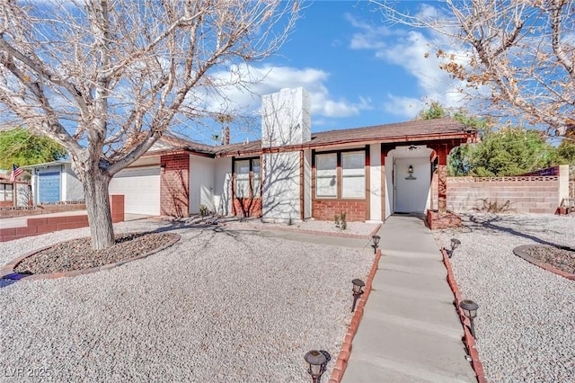 single story home featuring a garage