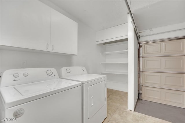 washroom featuring separate washer and dryer and light tile patterned floors