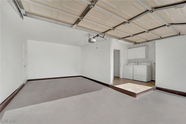 garage featuring a garage door opener and washer and dryer