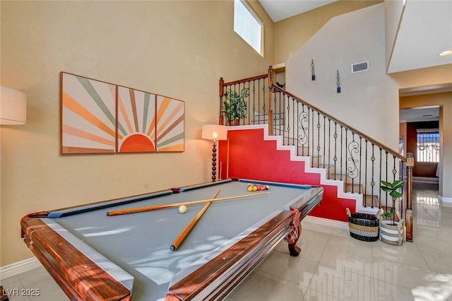 game room with a wall mounted air conditioner, light tile patterned flooring, and billiards