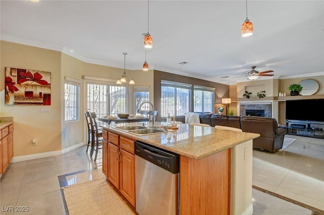 kitchen with pendant lighting, sink, light tile patterned floors, and stainless steel dishwasher