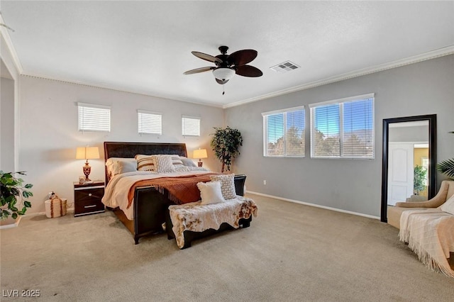 carpeted bedroom featuring ornamental molding and ceiling fan