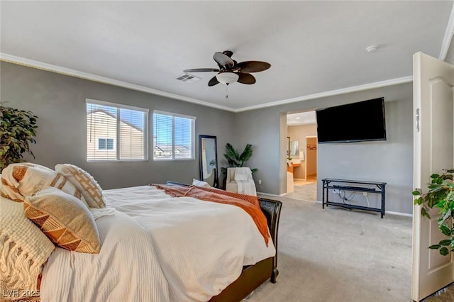 carpeted bedroom featuring crown molding, ceiling fan, and ensuite bathroom