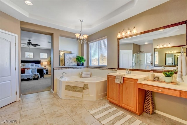 bathroom with a raised ceiling, tile patterned flooring, independent shower and bath, and ceiling fan with notable chandelier