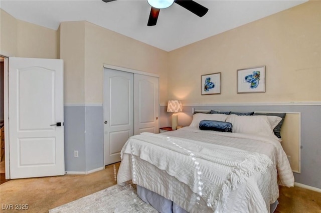 bedroom featuring ceiling fan, carpet flooring, and a closet