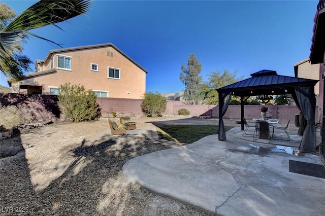 view of yard featuring a gazebo and a patio area