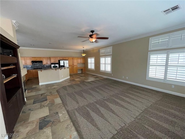 living room with ceiling fan and ornamental molding