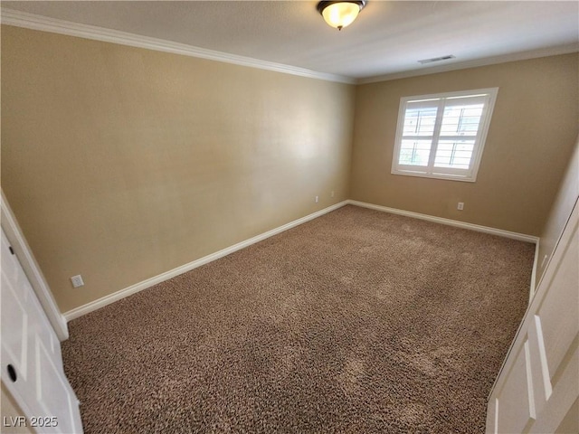 carpeted spare room with crown molding