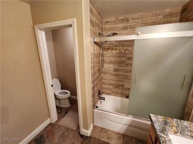 full bathroom with toilet, enclosed tub / shower combo, and vanity