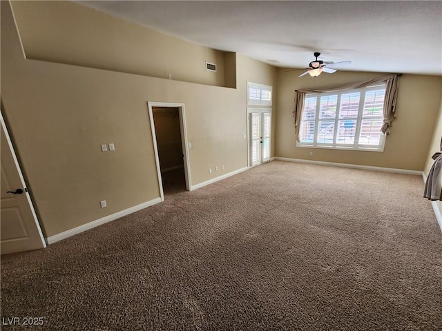 unfurnished living room with ceiling fan and carpet