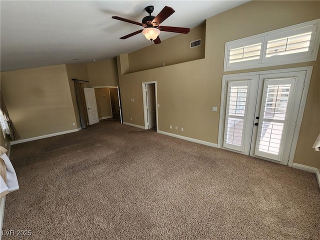 unfurnished room with ceiling fan, french doors, and carpet floors