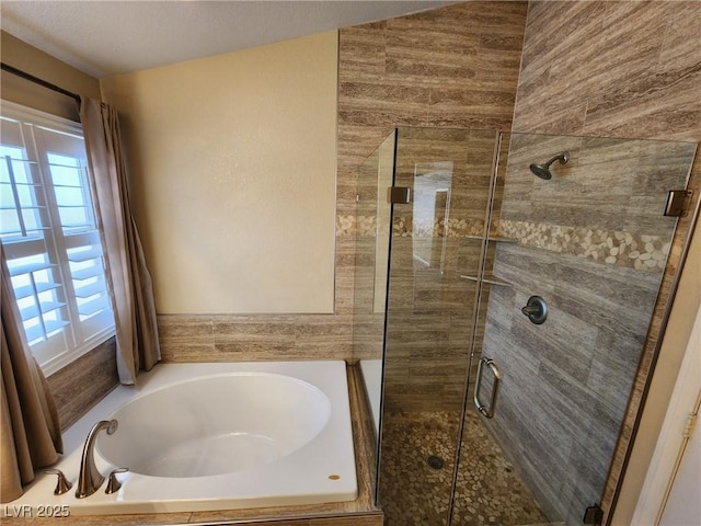 bathroom featuring plus walk in shower