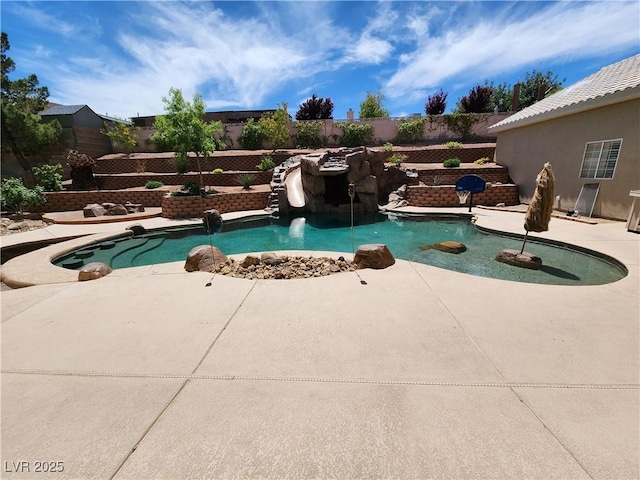 view of swimming pool featuring a patio area