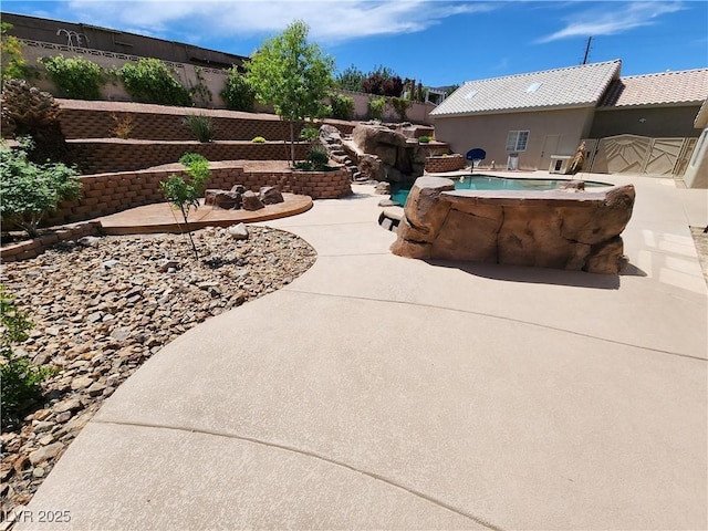 view of patio featuring a fenced in pool