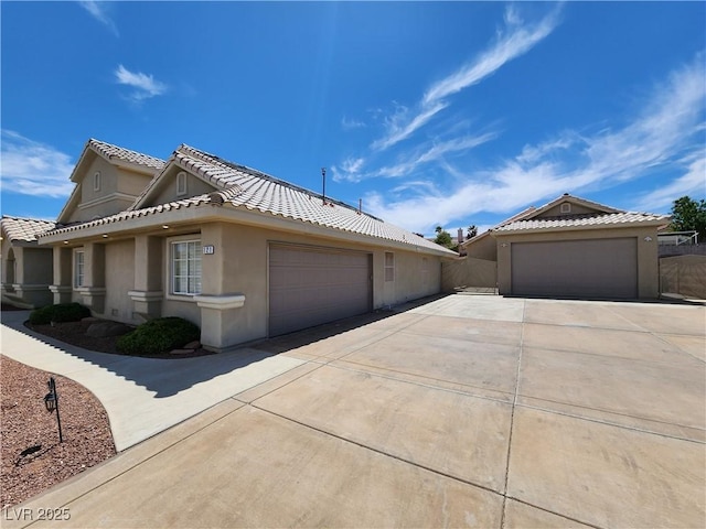 view of side of home with a garage