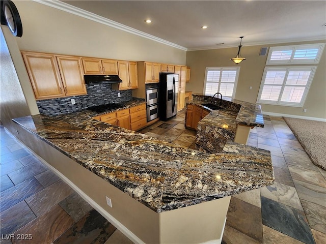 kitchen featuring black electric stovetop, decorative light fixtures, dark stone countertops, crown molding, and sink