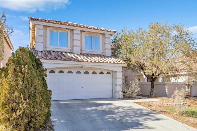 mediterranean / spanish-style house featuring a garage