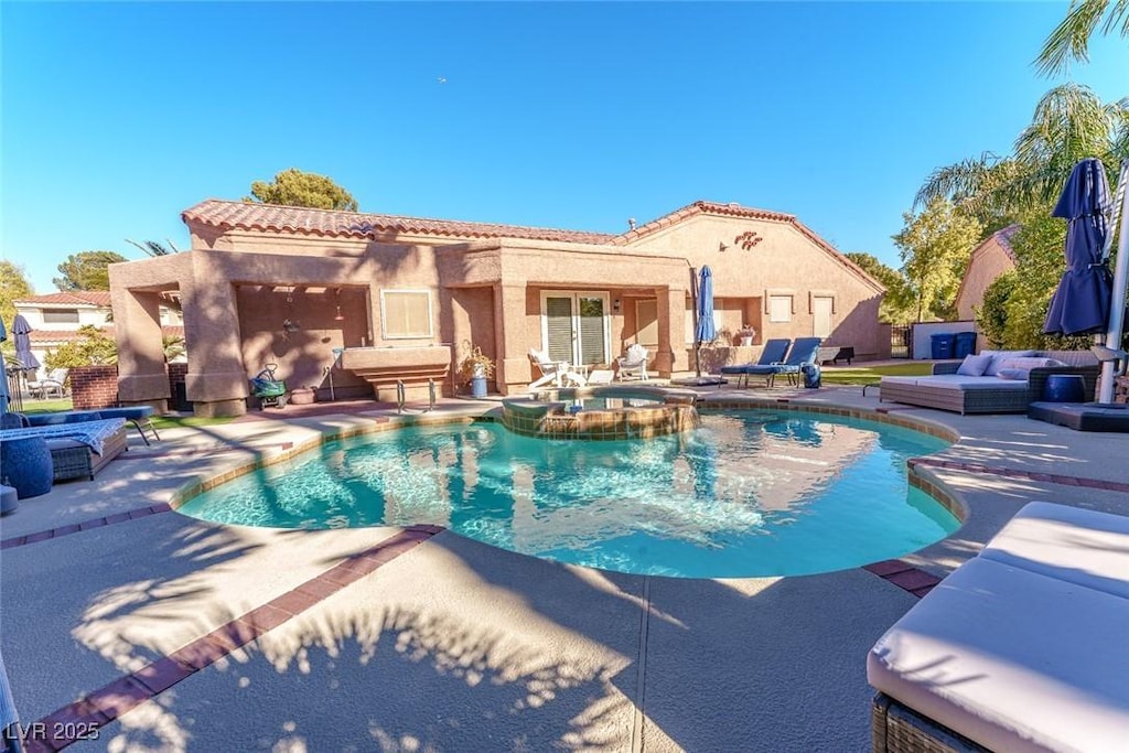 view of pool featuring french doors, an outdoor living space, a patio area, and an in ground hot tub