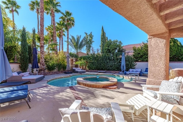 view of swimming pool with an outdoor living space, a patio area, and an in ground hot tub