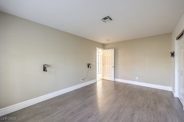 spare room featuring hardwood / wood-style flooring