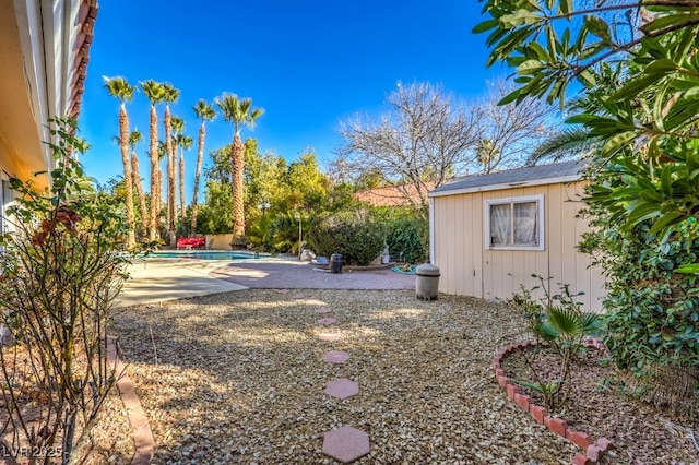 view of yard featuring an outbuilding and a patio