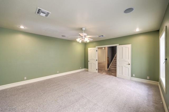 unfurnished bedroom with light carpet and ceiling fan